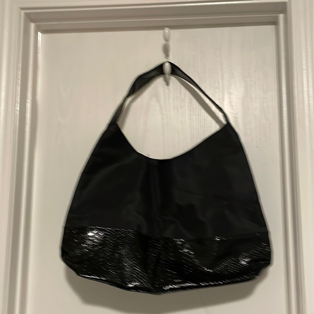 Black and I think fake snake skin or real I’m not sure good condition used